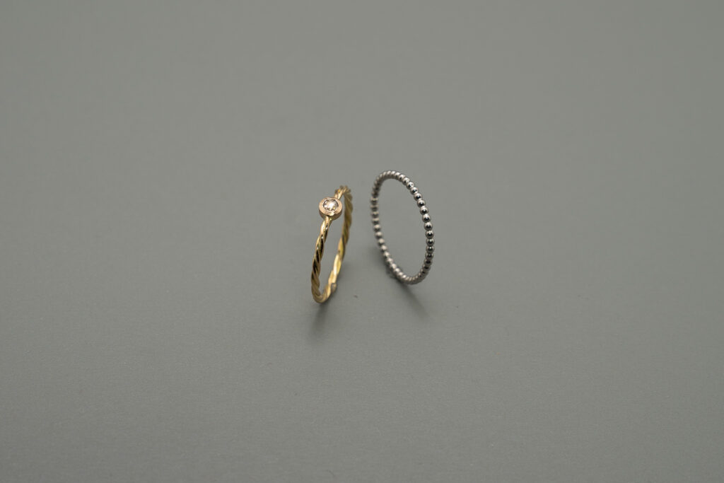 Flechtring Gold mit Diamantrose